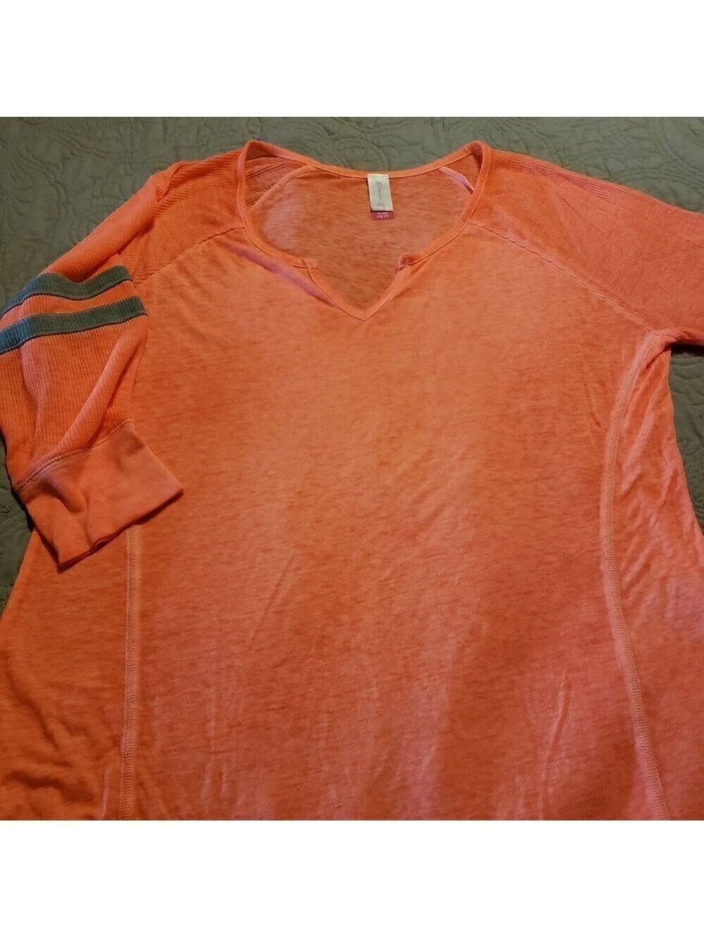 No Boundaries Orange burnout with gray stripes.